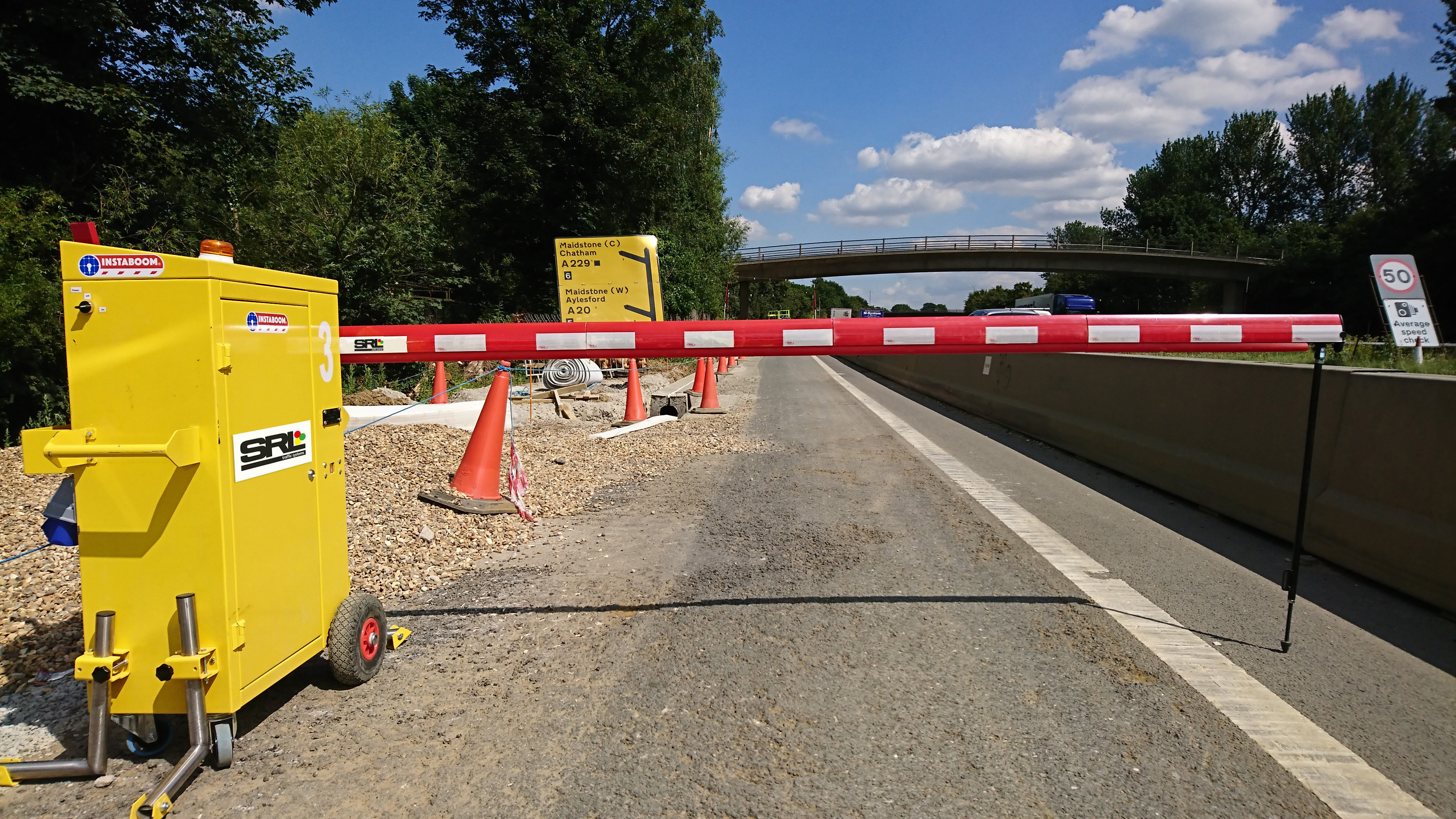 SRL Traffic Systems Solar Gates UK INSTABOOM work zone barriers BS/EN 13241-1 safety standards