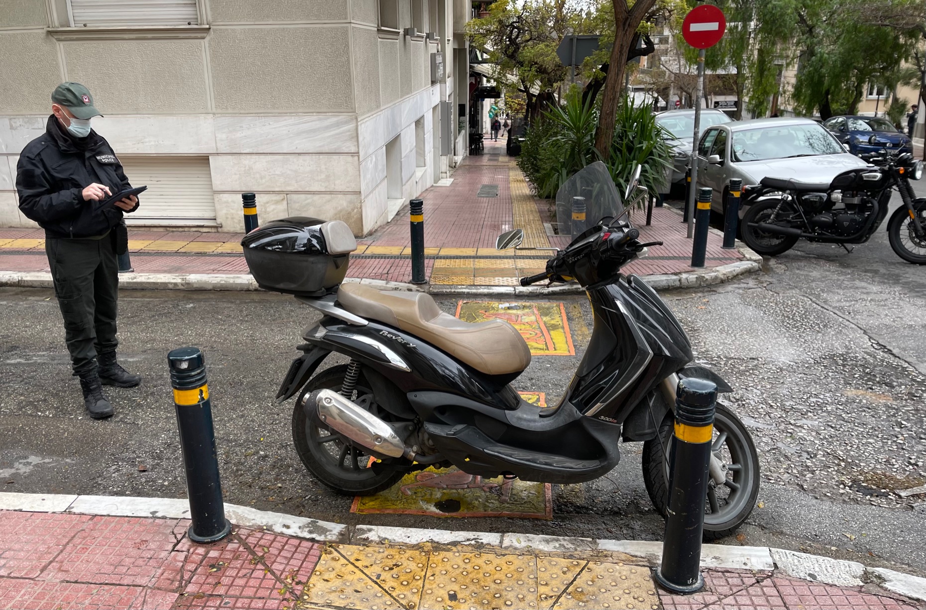 City of Athens illegal anti-social parking sensors road crossing pedestrian ramps