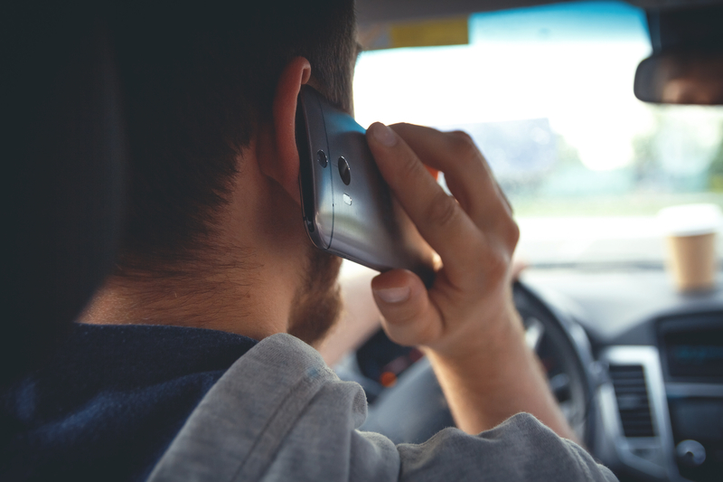Distracted driving road safety enforcement phone use © Maksim Marchanka | Dreamstime.com