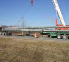 concrete poles being transported